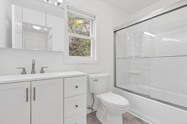 16 Copper Hill Dr Unit 16, Guilford, CT 06437 - bathroom with vanity, shower / bath combination with glass door, and toilet