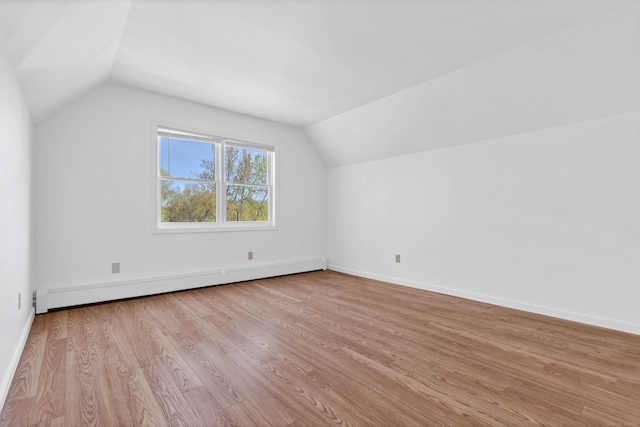 16 Copper Hill Dr Unit 16, Guilford, CT 06437 - additional living space with baseboards, a baseboard heating unit, wood finished floors, and lofted ceiling