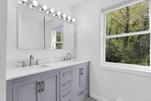 16 Copper Hill Dr Unit 16, Guilford, CT 06437 - full bath with double vanity, a sink, and baseboards