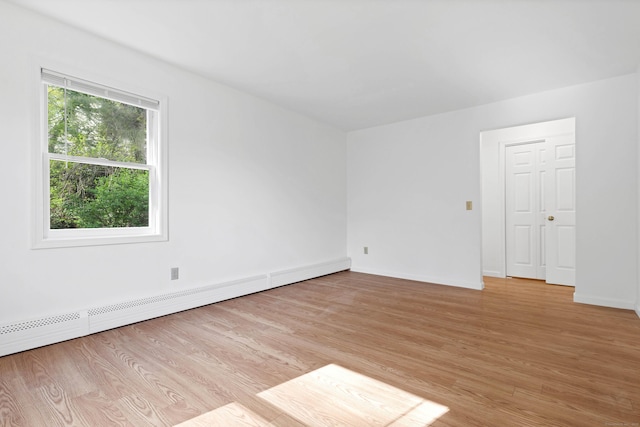 16 Copper Hill Dr Unit 16, Guilford, CT 06437 - empty room featuring baseboards, baseboard heating, and light wood finished floors