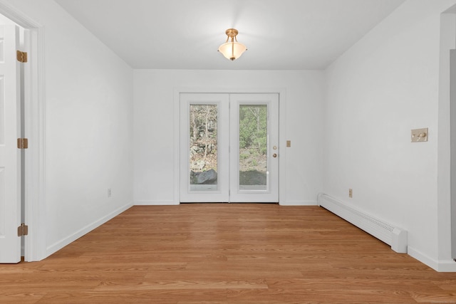 16 Copper Hill Dr Unit 16, Guilford, CT 06437 - unfurnished dining area with baseboards, baseboard heating, and light wood-style flooring