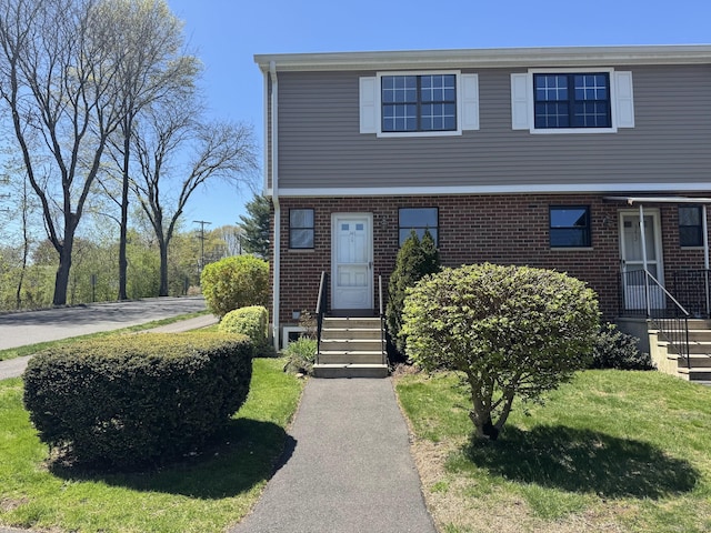 view of front of home featuring brick siding and entry steps