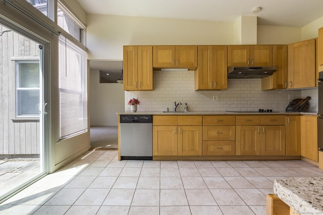 kitchen featuring stainless steel dishwasher, black electric cooktop, under cabinet range hood, a sink, and backsplash