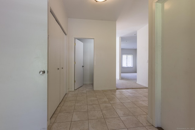 hallway featuring light tile patterned floors