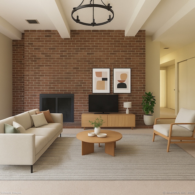 living area featuring visible vents, beam ceiling, and a fireplace
