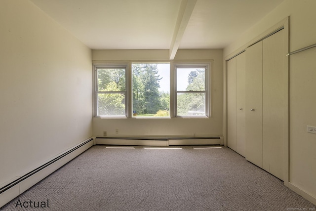 unfurnished bedroom with baseboard heating, beamed ceiling, and light carpet