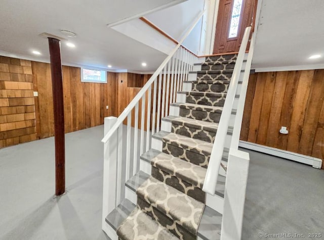37 Russell Rd, Norwich, CT 06360 - stairway with recessed lighting, concrete flooring, wooden walls, and baseboard heating