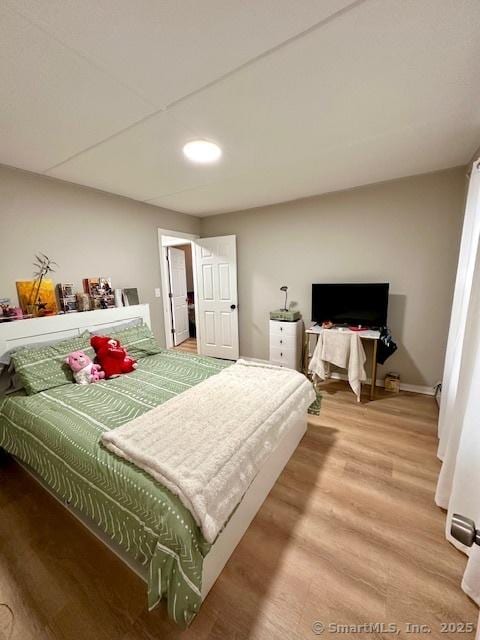 bedroom featuring wood finished floors