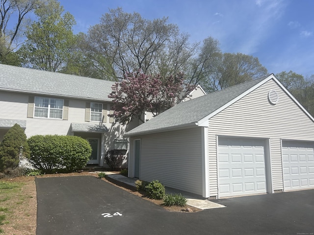 3409 Whitney Ave Apt 24, Hamden, CT 06518 - view of side of home with roof with shingles