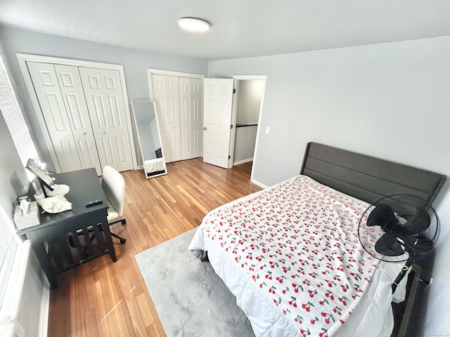 3409 Whitney Ave Apt 24, Hamden, CT 06518 - bedroom with two closets, wood finished floors, and baseboards
