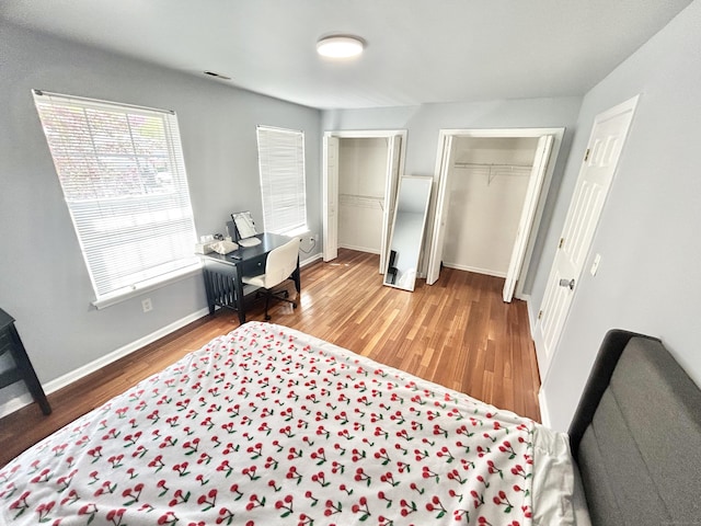 3409 Whitney Ave Apt 24, Hamden, CT 06518 - bedroom featuring wood finished floors and baseboards