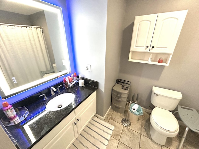 3409 Whitney Ave Apt 24, Hamden, CT 06518 - full bath featuring toilet, vanity, tile patterned floors, baseboards, and a shower with curtain