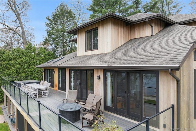 wooden terrace featuring outdoor dining area