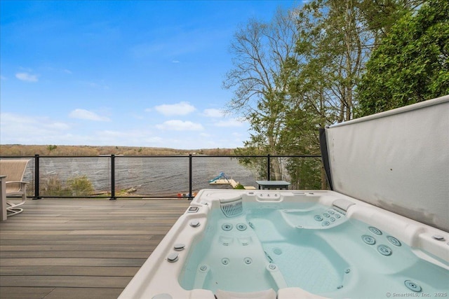 wooden deck with a hot tub