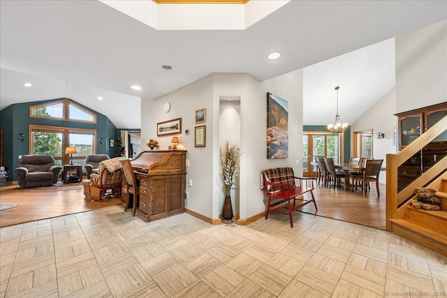 interior space with baseboards, a chandelier, vaulted ceiling, and parquet flooring