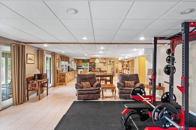 workout room featuring recessed lighting and a drop ceiling