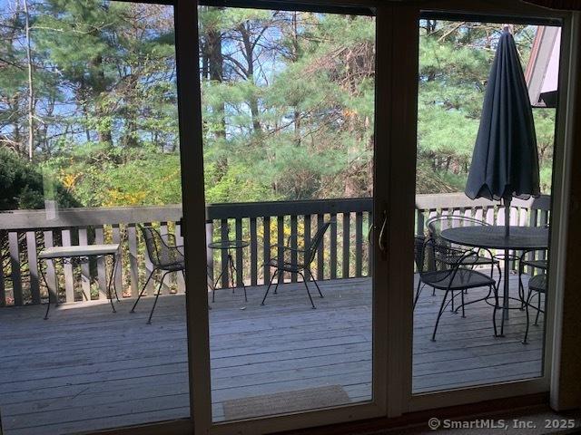 wooden deck featuring outdoor dining area