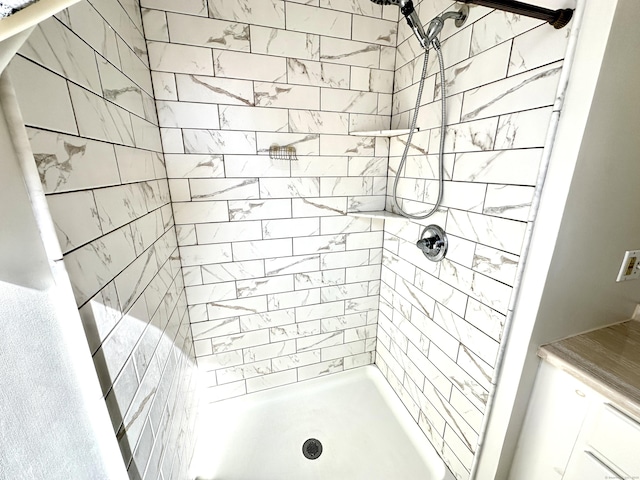 full bath with a shower stall