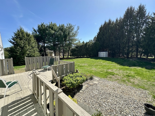 view of yard featuring a storage unit and an outdoor structure