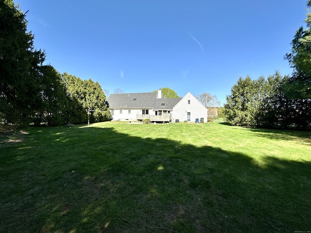 view of yard featuring a deck