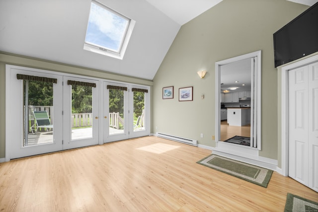 3 Eastwood Dr, Granby, CT 06060 - spare room featuring a baseboard radiator, plenty of natural light, a skylight, wood finished floors, and high vaulted ceiling