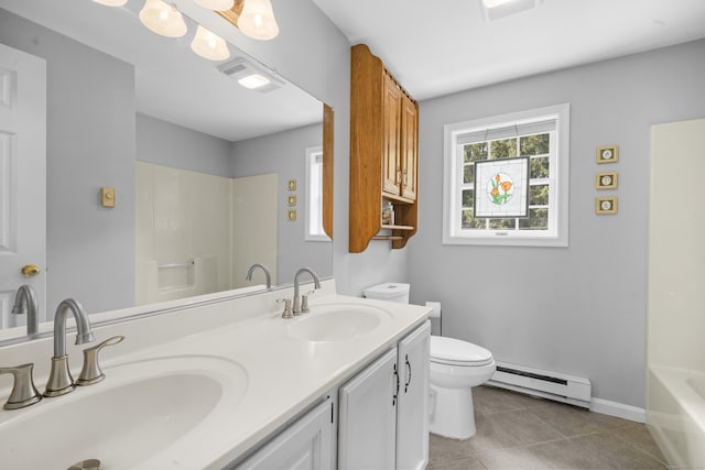 3 Eastwood Dr, Granby, CT 06060 - full bathroom featuring a baseboard heating unit, toilet, tile patterned flooring, a bath, and double vanity