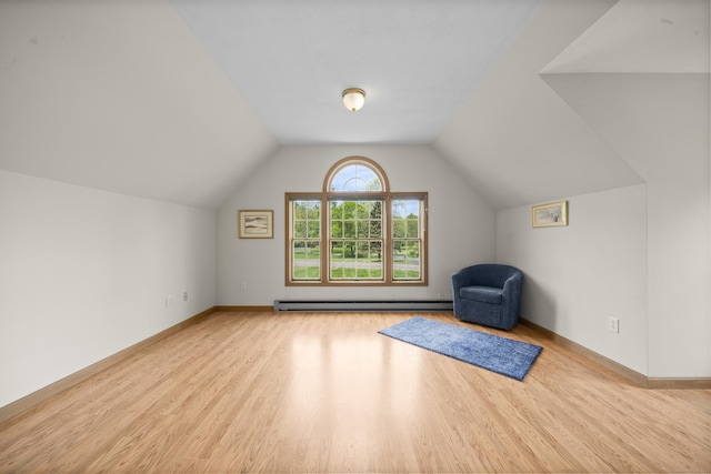 3 Eastwood Dr, Granby, CT 06060 - additional living space with baseboard heating, wood finished floors, vaulted ceiling, and baseboards
