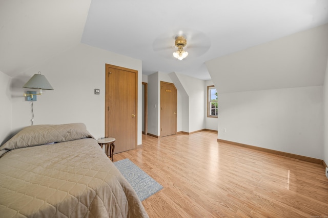 3 Eastwood Dr, Granby, CT 06060 - bedroom with light wood finished floors, vaulted ceiling, baseboards, and a ceiling fan