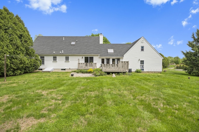 3 Eastwood Dr, Granby, CT 06060 - back of property with a deck, a chimney, a lawn, and roof with shingles
