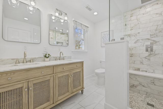 full bath featuring visible vents, a sink, marble finish floor, and a walk in shower