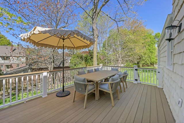 wooden terrace featuring outdoor dining area