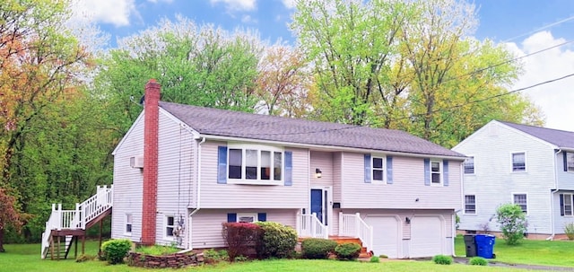 283 Hillcrest Ave, Newington, CT 06111 - bi-level home featuring stairway, a garage, a front yard, and a chimney