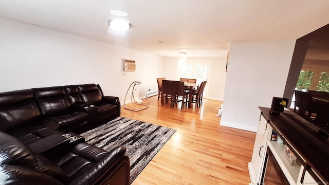 283 Hillcrest Ave, Newington, CT 06111 - living area featuring a baseboard heating unit, light wood-style flooring, and baseboards