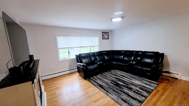 283 Hillcrest Ave, Newington, CT 06111 - living area with a baseboard radiator, light wood-style floors, and baseboards