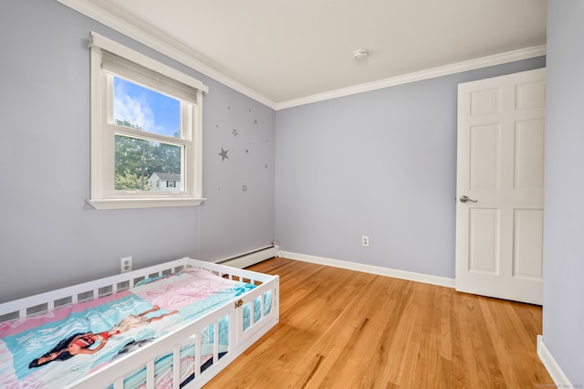283 Hillcrest Ave, Newington, CT 06111 - bedroom featuring ornamental molding, a baseboard radiator, light wood-style flooring, and baseboards