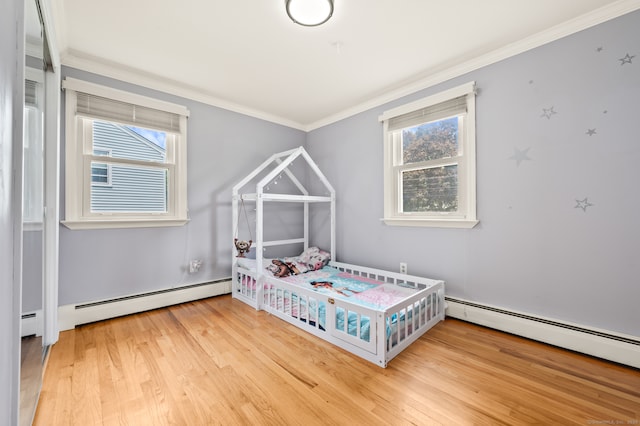 283 Hillcrest Ave, Newington, CT 06111 - bedroom with wood finished floors, ornamental molding, and a baseboard heating unit