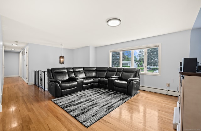 283 Hillcrest Ave, Newington, CT 06111 - living area with a baseboard radiator, light wood-style flooring, and baseboards