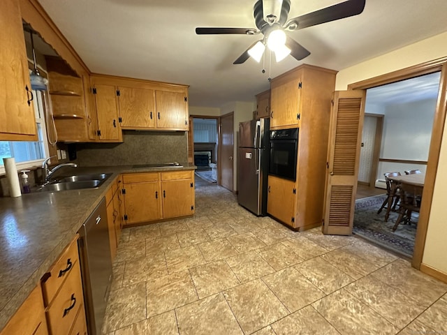 kitchen featuring dark countertops, open shelves, a sink, a ceiling fan, and black appliances