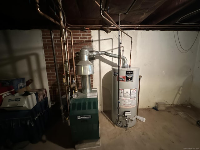 utility room featuring gas water heater