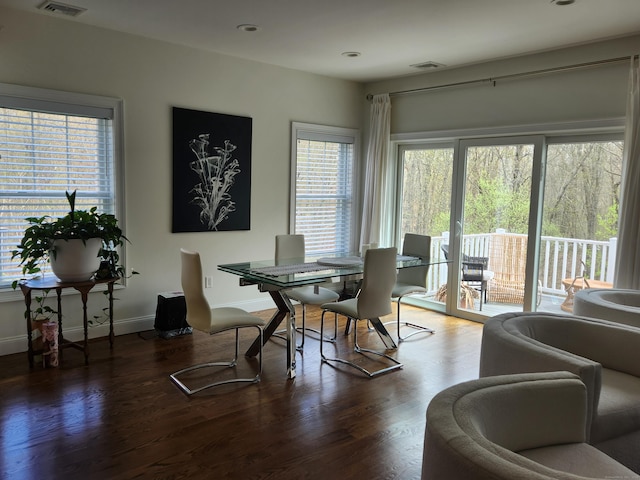 dining room with baseboards, recessed lighting, wood finished floors, and visible vents