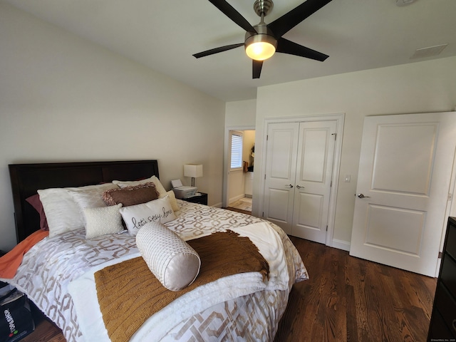 bedroom with baseboards, a ceiling fan, a closet, and wood finished floors