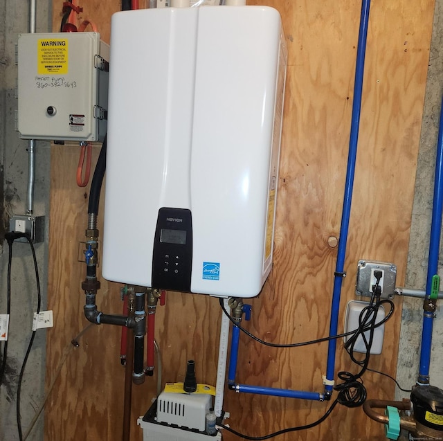 utility room featuring water heater