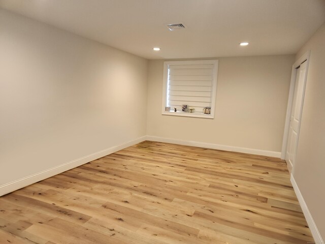 unfurnished room with baseboards, recessed lighting, light wood-style flooring, and visible vents