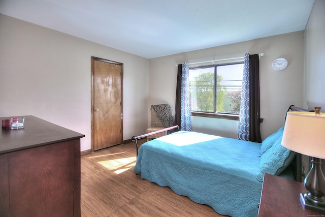 bedroom with wood finished floors