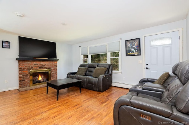 38 Black Bridge Rd, Newtown, CT 06482 - living area with baseboards, a fireplace, a baseboard heating unit, and light wood finished floors