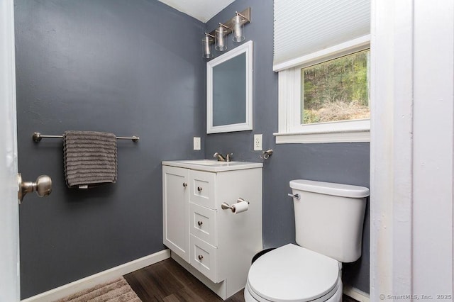 38 Black Bridge Rd, Newtown, CT 06482 - bathroom with toilet, baseboards, wood finished floors, and vanity