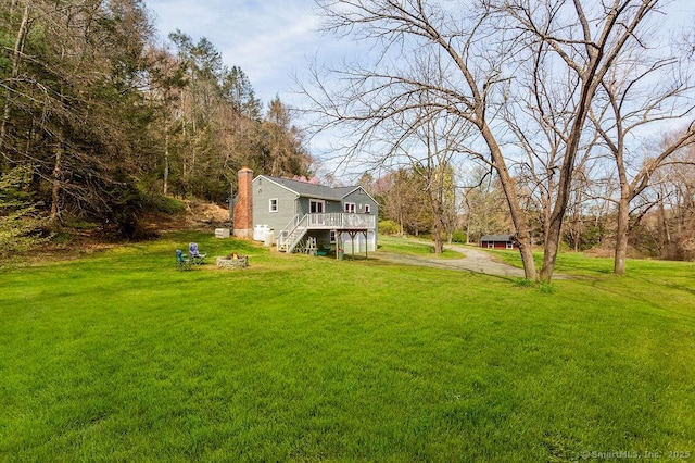38 Black Bridge Rd, Newtown, CT 06482 - view of yard with stairway, an outdoor fire pit, driveway, and a deck