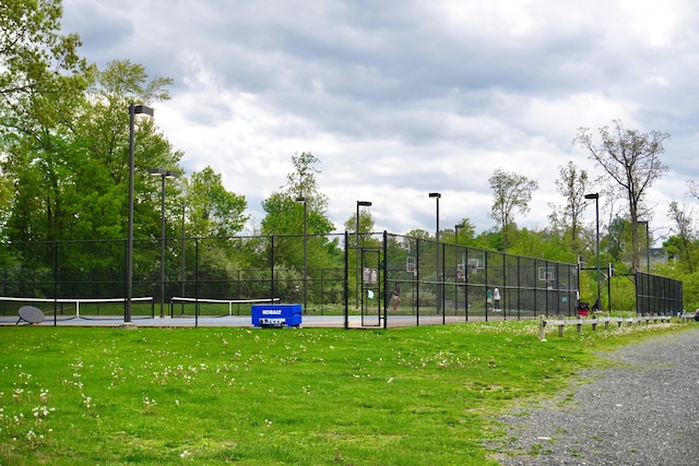 view of community with a tennis court