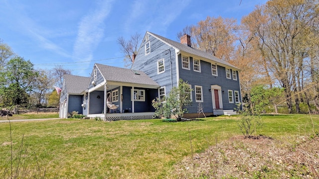32 Great Hill Pond Rd, Portland, CT 06480 - colonial-style house with covered porch, a chimney, roof with shingles, a front lawn, and an attached garage