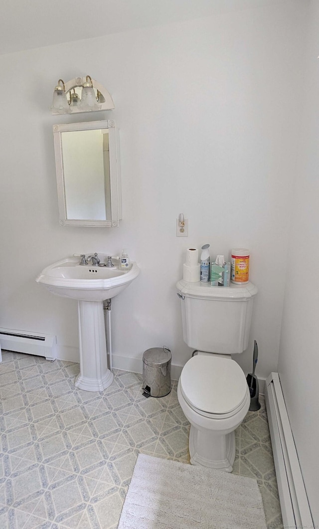32 Great Hill Pond Rd, Portland, CT 06480 - half bathroom with toilet, baseboards, and a baseboard heating unit